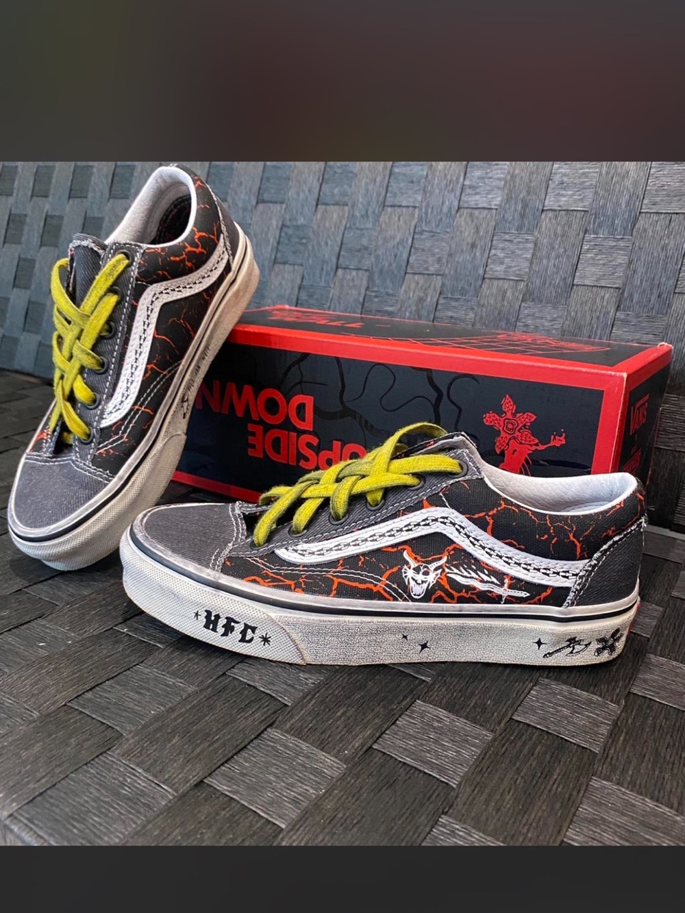 Vans Black & Red Lightning Low-Top Skate Shoes with Yellow Laces.